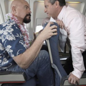 Men facing off about tight space on an airplane