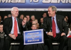 Senator John McCain and President George W Bush with "Keeping our Promise to Seniors" sign