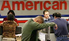 exasperated man at American Airlines Counter