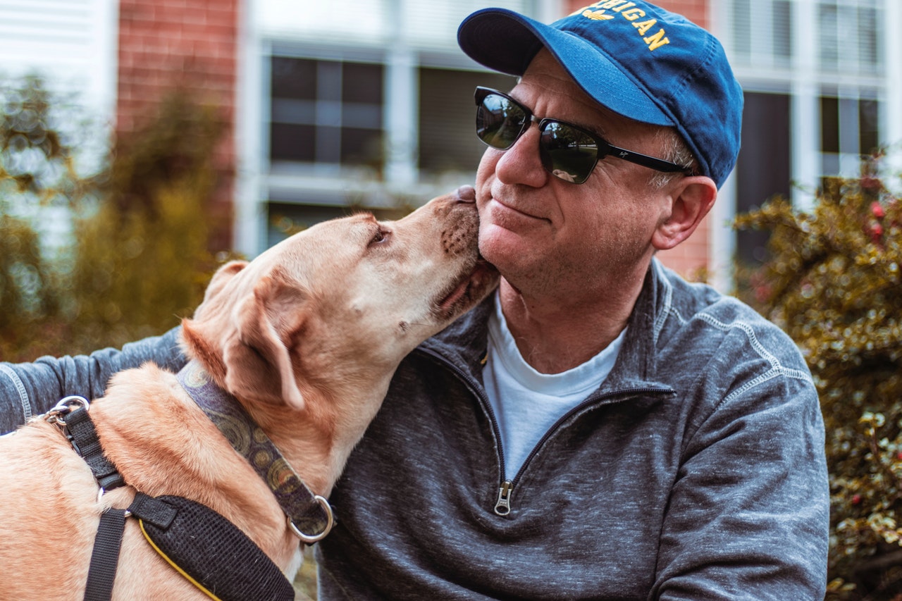 man in hat owning a pet in retirement